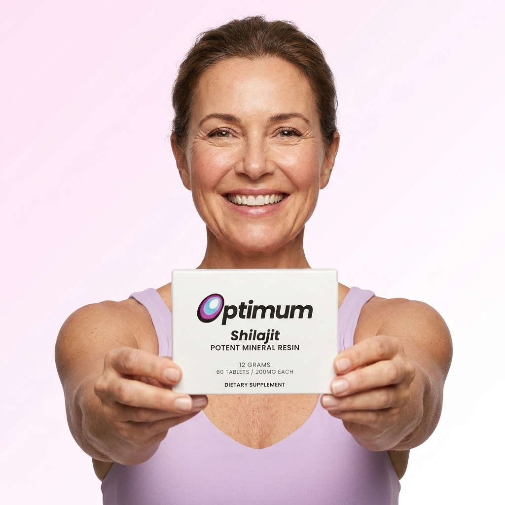 A woman holding the Optimum Shilajit box, beaming