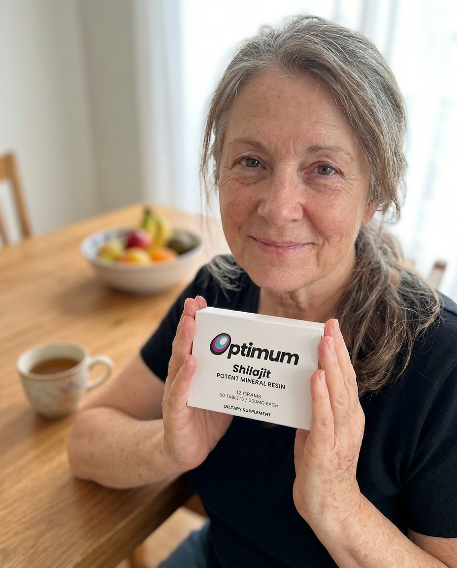 Nancy B., verified Optimum customer holding the box